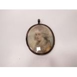 Miniature watercolour portrait of a young lady in period costume with lock of hair to reverse.