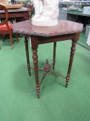 Hexagonal oak occasional table on turned supports. Estimate £10-20.
