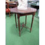 Hexagonal oak occasional table on turned supports. Estimate £10-20.