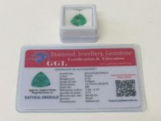Natural trillion cut emerald, 6.70 carat, with certificate. Estimate £50-70.