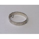 A silver hinged bracelet with engraved decoration, London 1963, wt 0.76ozt. Estimate £30-40.