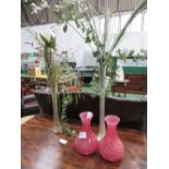 2 floral display & a pair of red spiral effect glass vases, height of vases 28cms. Estimate £15-25.