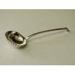 Silver ladle with scalloped decoration, London 1895, wt 2.65ozt. Estimate £20-30.