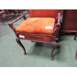 Piano stool with rising lid. Estimate £20-30.