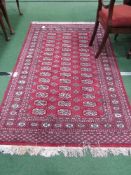 Red ground patterned Bokara runner, 187 x 122. Estimate £30-40.