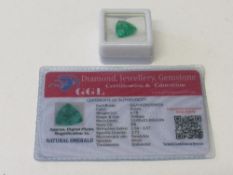 Natural trillion cut emerald, 6.70 carat, with certificate. Estimate £50-70.