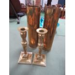 2x 1943 shell cases, 75mm & 2 brass candlesticks. Estimate £20-30.