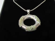 Silver necklace & hoop pendant set with green stones. Estimate £10-20.
