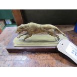 Brass greyhound on wooden plinth. Estimate £5-10.