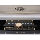 Accurist 'gold' lady's wristwatch in 9ct gold case with black leather strap, in original box.