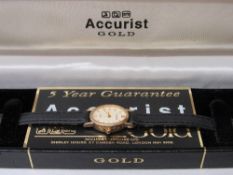 Accurist 'gold' lady's wristwatch in 9ct gold case with black leather strap, in original box.