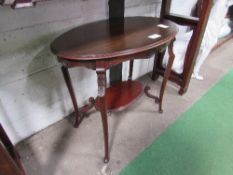 Mahogany oval display table with under shelf, 81cms x 52cms x 71cms. Estimate £20-30.