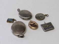 A small locket of 9ct gold front & back; 2 silver plated lockets; another locket; a sterling