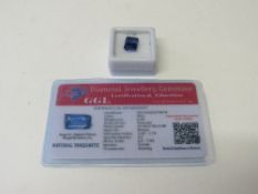 Natural blue emerald cut tanzanite, 6.4 carat, with certificate. Estimate £50-70.