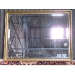 Gilt framed bevel edge mirror, 87cms x 112cms. Estimate £40-60.