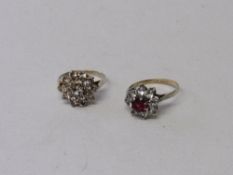 A 9ct gold & silver red & clear stone cluster ring, 2.4gms & a clear stone cluster ring,