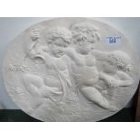 Plaster plaque depicting 3 cherubs, 70cms diameter. Estimate £20-30.