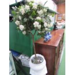 White ceramic jardinere on stand c/w artificial rose bush. Estimate £20-30.