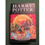 Harry Potter 1st edition, Harry Potter & the Deathly Hallows, with dust cover. Estimate £40-50.