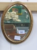 2 oval gilt framed wall mirrors. Estimate £20-30.