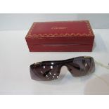 Vintage Cartier sunglasses in good condition. Estimate £100-120.