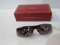 Vintage Cartier sunglasses in good condition. Estimate £100-120.