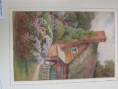 Framed & glazed watercolour of girl by a cottage entitled 'At Welford-on-Avon' signed Ethel