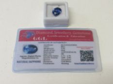 Natural blue oval cut sapphire, wt 9.1 carat, with certificate. Estimate £50-70.