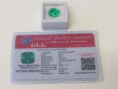 Natural cushion cut emerald, 7.9 carat, with certificate. Estimate £50-70.