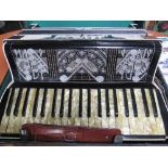 Alvari accordion in original case together with 2 music books. Estimate £40-60.