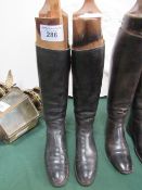 Pair of Edwardian black leather riding boots with Maxwell of Dover St. London wooden trees. Estimate