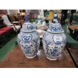 2 oriental blue & white covered jars, height 42cms. Estimate £20-40.