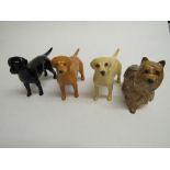 4 Beswick dogs: Black Labrador, 2 Gold Labradors & a Yorkshire Terrier