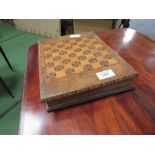 Compendium of games: Chess, dominoes etc, in a chequer board box. Estimate £10-20.