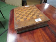 Compendium of games: Chess, dominoes etc, in a chequer board box. Estimate £10-20.