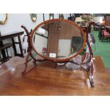 Mahogany framed toilet mirror in scrolled work frame. Estimate £30-60.