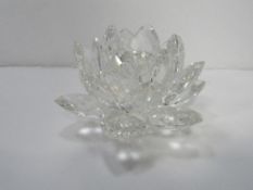 Crystal rock large crystal glass flower design candlestick. Estimate £10-20.