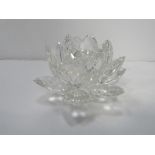 Crystal rock large crystal glass flower design candlestick. Estimate £10-20.