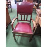 2 mahogany leather back open armchairs. Estimate £40-50.