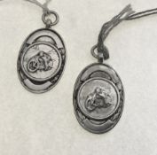 2x 1930's sterling silver TT racing medals. Estimate £30-40.
