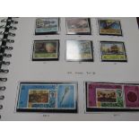 4 various stamp albums & a tin containing stamps. Estimate £10-20.