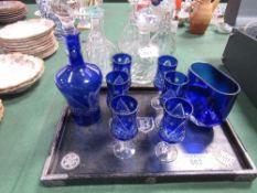 Blue glass star cut decanter & 6 glasses together with a blue vase on ebonised wooden tray with