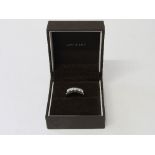 18ct white gold ring set with 5 diamonds, 0.99ct, size R, wt 3.9gms. Estimate £400-500.