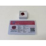 Natural red cushion cut ruby, 10.5 carat, with certificate. Estimate £50-70.