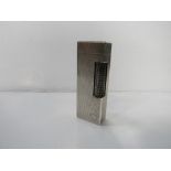 Authentic Dunhill silver rollagas lighter, Swiss made with Code 13373. Estimate £40-60.