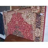 Red ground Keshan carpet, 2.8 x 2.0. Estimate £80-100.