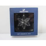 Swarovski crystal glass snowflake in box, 2014 boxed gift. Estimate £10-15.