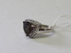 Hallmarked 925 silver ring with a brown triangular stone, size Q. Estimate £20-30.