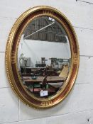 Pair of gold framed bevel edge wall mirrors, height 81cms. Estimate £60-80.