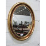 Pair of gold framed bevel edge wall mirrors, height 81cms. Estimate £60-80.